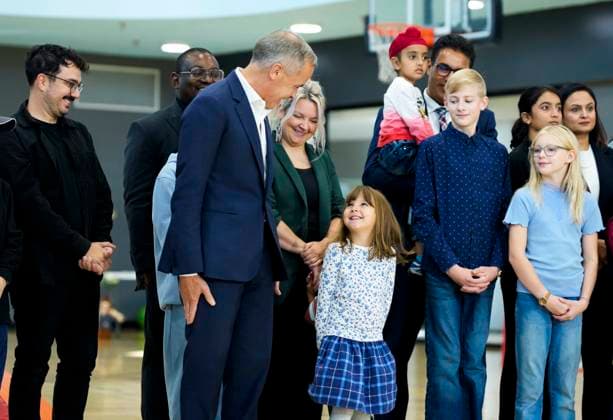 October 10, 2025, Ottawa, On, CAN: Prime Minister Mark Carney jokes with a youngster about the posture they will have to take as they stand in the background before an announcement at a community centre in Ottawa, on Friday, Oct. 10, 2025. Ottawa CAN - ZUMAc35_ 20251010_zaf_c35_022 Copyright: xJustinxTangx