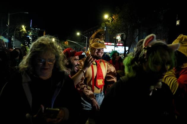 October 31, 2025, New York, New York, USA: Participants dressed as Donkey Kong and Mario from the Nintendo video game series have a laugh and seen through crowd during the Village Halloween Parade, which takes place annually in New York City, beginning at Canal Street and proceeding up Sixth Avenue to 16th Street. According to the paradeâ€⠢s official website, this yearâ€⠢s event featured an estimated 50,000 participants and drew more than one million spectators. New York USA - ZUMAo116 20251031_znp_o116_103 Copyright: xBiancaxOterox