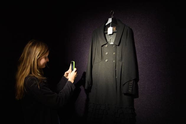 Bonhams Sound & Cinema: With Property from The Marianne Faithfull Estate Sale - Bonhams, London, UK - 1 December 2025 A staff member views A Louis Vuitton, Marc Jacobs Black Wool Coat owned by Marianne Faithfull (est. £300 - £500) which is on auction at Bonhams Sound & Cinema: With Property from The Marianne Faithfull Estate Sale ending from 3rd December 2025 at Bonhams in London, England, UK on Monday 1 December, 2025., Credit:Justin Ng Avalon UK, England, London, Bonhams Copyright: xJustinxNgx xAvalonx 1055809850
