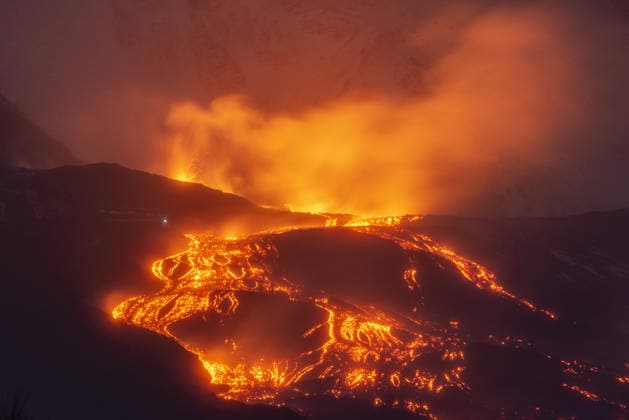Mount Etna lava flow continues as new fissure opens on eastern flank CATANIA, ITALY - JANUARY 02: Volcanic activity continues at Mount Etna after late December 2025 paroxysms at the North-East Crater in Catania, Italy on January 02, 2026. Although explosive activity at the summit has decreased, a new eruptive fissure opens on January 1, 2026, at about 2,000 meters on the volcano’s eastern flank, generating a lava flow into the Valle del Bove. Experts monitor the lateral effusive activity, which remains distant from populated areas and poses no immediate threat. The VONA alert level stays at orange, and Catania International Airport remains fully operational with no impact on air traffic. Photo taken from Zafferana Etnea, near Catania. Salva Copyright: x2026xAnadoluxSalvatorexAllegrax