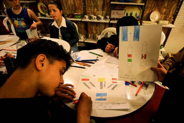 May 5, 2026, Beirut, Beirut, Lebanon: Displaced children draw during a workshop and an exhibition at a local theatre under the slogan Our Land, Our Identity , showcasing childrenâ€⠢s artwork about memory, belonging and hope. Despite an announced ceasefire between Israel and pro-Iranian Hezbollah in place since 17 April, the displacement and humanitarian crisis in Lebanon is far from over. This is a deeply fragile moment, marked by ongoing Israeli airstrikes, shelling, demolitions, evacuation orders, bans on return to certain areas and movement restrictions that continue to drive repeated displacement and rapidly growing humanitarian needs. Beirut Lebanon - ZUMAn313 20260505_zip_n313_006 Copyright: xMarwanxNaamanix