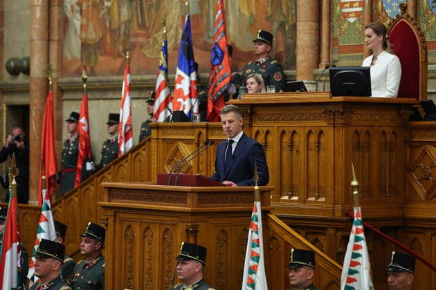 (260509) -- BUDAPEST, May 9, 2026 -- Peter Magyar, newly elected prime minister of Hungary, delivers a speech at the House of Parliament in Budapest, Hungary, on May 9, 2026. Peter Magyar, leader of Hungary s Tisza Party, was elected prime minister of Hungary in a vote at the inaugural session of the new parliament on Saturday. A total of 195 out of the 199 members of parliament cast votes, with 140 in favor, 54 against and 1 abstentions. Magyar secured the required majority to be elected prime minister, marking the start of his four-year term. In the parliamentary elections held on April 12, the Tisza Party, led by Magyar, defeated the ruling Fidesz-KDNP coalition led by Viktor Orban, winning 141 of the 199 seats and securing a two-
