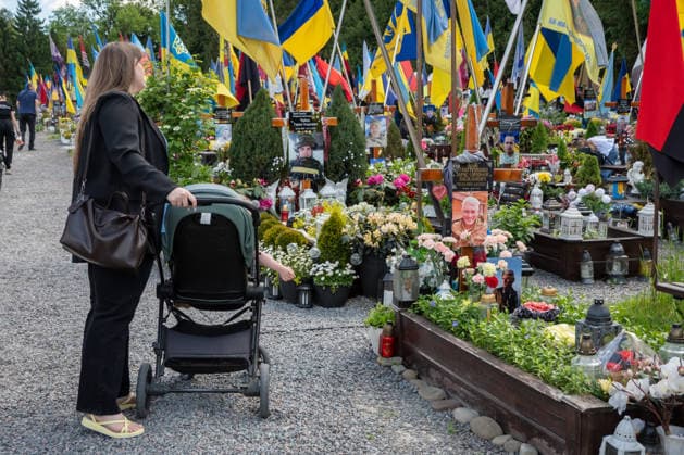Commemoration procession held on Heroes Day in Lviv, Ukraine LVIV, UKRAINE, MAY 23: Military and civilians take part in a ceremony to honor the memory of fallen servicemen at the honorary burial grounds at the Lychakiv Cemetery during the Day of Heroes of Ukraine in Lviv, Ukraine, May 23, 2026. Also on this day, military personnel, police, members of youth organizations and civilians marched through the city in a solemn procession dedicated to all participants of the ATO JFO, war veterans and participants who died or are fighting for the freedom of Ukraine. Olena Znak Anadolu Lviv Ukraine. Editorial use only. Please get in touch for any other usage. Copyright: x2026xAnadoluxOlenaxZnakx