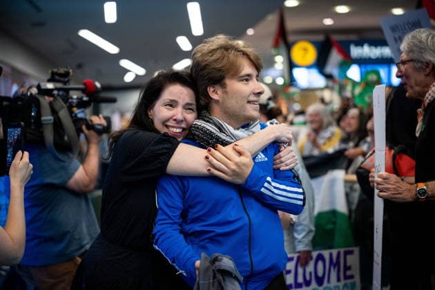 May 24, 2026, Vancouver, Bc, CANADA: Sebastian Tow, right, member of the Gaza flotilla, reunites with his mother Anita Wittenberg as he arrives at the Vancouver International Airport in Richmond B.C., on Sunday, May 24, 2026. Vancouver CANADA - ZUMAc35_ 20260524_zaf_c35_148 Copyright: xEthanxCairnsx