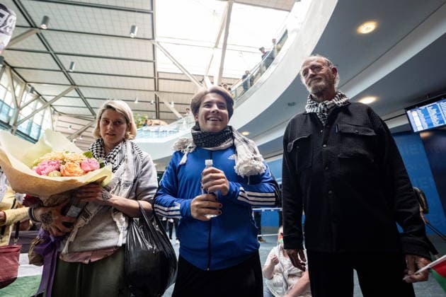 May 24, 2026, Vancouver, Bc, CANADA: Mary Grace Mathisen, left to right, Sebastian Tow, and Michael France, members of the Gaza-bound flotilla which was detained by Israel, arrive at the Vancouver International Airport in Richmond, B.C., on Sunday, May 24, 2026. Vancouver CANADA - ZUMAc35_ 20260524_zaf_c35_187 Copyright: xEthanxCairnsx