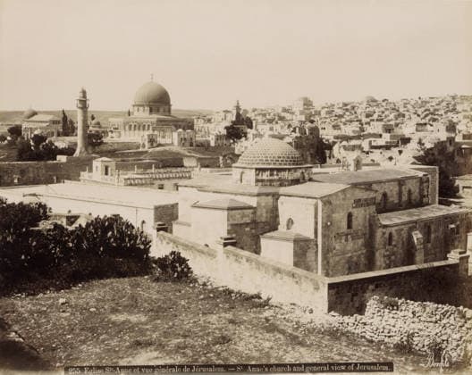 RECORD DATE NOT STATED Eglise Ste-Anne et vue gà nà rale de Jà rusalem.- St Anne s church and general view of Jerusalem., View of Jerusalem with St. Anne s Church in the foreground, photograph, Part of Travel album with photos of Jerusalem and other biblical places., negative number: 255 , photographer: Maison Bonfils, Jerusalem, c. 1867 - c. 1895, pasteboard, paper, albumen print, height 226 mm x width 283 mm, prospect of city, town panorama, silhouette of city, church (exterior), St. Anne s Church (Jerusalem), A wide sepia-toned cityscape with a large domed building prominently near the center, several smaller domes and towers scattered across the view, a tall cylindrical minaret with a balcony rising in front of the domed complex, stone buildings with flat ro Copyright Penta Springs LCK260531_18268