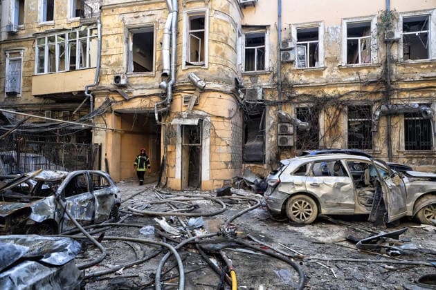 A State Emergency Service worker emerges from a passage in the courtyard of a multi-storey apartment block damaged by a Russian attack, Odesa, Ukraine, August 9, 2026. On Sunday night, August 9, the Russian army carried out a massive combined attack on Odesa, causing significant destruction in two districts of the southern Ukrainian port city. In central Odesa, a Russian missile hit a four-storey residential building, where two floors were completely burnt out. Two private houses and offices were also damaged. At least six civilian cars were destroyed or badly damaged in courtyards by falling debris and direct hits. Damage to energy facilities led to a temporary blackout, with partial power outages in the Peresypskyi (Poskot), Prymorskyi, K Copyright: xNinaxLiashonokx