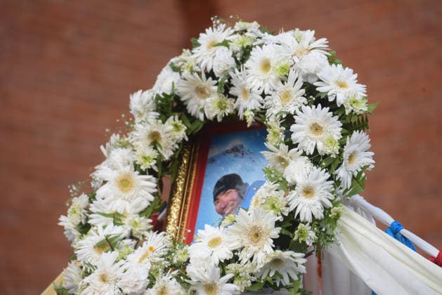 August 11, 2026, Kathmandu, Bagmati, Nepal: A photograph of Nepali mountaineer Kilu Pemba Sherpa is displayed with a garland as the remains of the three climbers are brought to Tribhuvan International Airport in Kathmandu, Nepal, on August 11, 2026, after being repatriated from Pakistan following the Broad Peak avalanche tragedy. Kilu Pemba Sherpa was among 10 members of an international expedition killed in an avalanche while ascending toward Camp 3 on Broad Peak (8,047 m) in Pakistanâ€⠢s Karakoram Range. The tragedy also claimed the lives of renowned British-Nepali mountaineer Nirmal â€oeNims†Purja, Pur Bahadur Gurung (Yukta), Nima Sherpa, Nawang Thindu Sherpa, Gyalu Sherpa, Wang Zhong of China, Nadhira Ahmed Abdullah Al Ha - ZUMAs330 20260811_zsp_s330_022 Copyright: xSafalxPrakashxShresthax