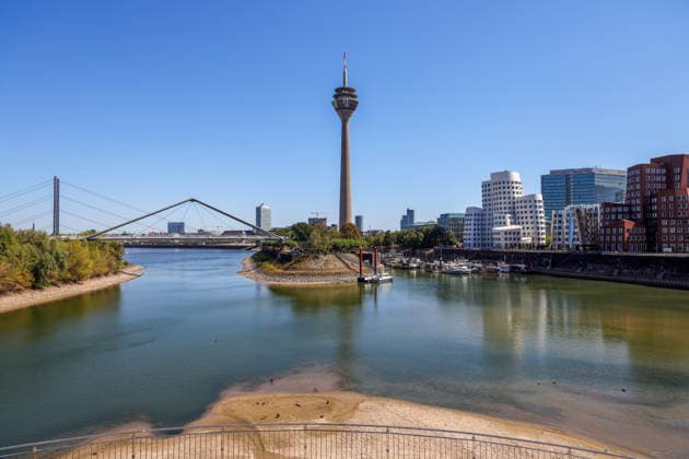 August 13, 2026, Germany, North Rhine-Westphalia, Weather, Heat, Rivers, Low Water Levels, Drought, Due to the heat, the water level of the Rhine in Düsseldorf s Medienhafen has dropped significantly; Rhine Tower, Gehry Building, Germany Copyright: xD.xKerlekin SnowfieldxPhotographyx SF130826HafenD7
