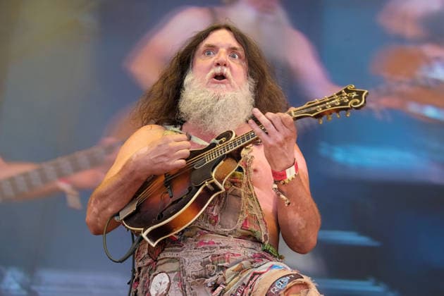 August 15, 2026, Williamscot, Oxfordshire, United Kingdom: English mandolin player and multi-instrumentalist Hippy Joe Hymas, also known as Joe Revolta performing live on stage at Fairport s Cropredy Convention with American Rockgrass band Hayseed Dixie. Formed in Nashville, Tennessee, in 2000,Hayseed Dixie is an American band that quoined the term rockgrass, which is hard rock and heavy metal songs played on traditional bluegrass instruments with. Their name is a parody of heavy metal band AC DC. The band consists of John Wheeler Barley Scotch on vocals, guitars, fiddle, keyboards, Hippy Joe Hymas on mandolin, acoustic guitar, vocals Jake Byers on bass, vocals Richard Collins on Banjo and vocals. Williamscot United Kingdom - ZUMAs197 20260815_aaa_s197_194 Copyright: xDawnxFletcher-Parkx