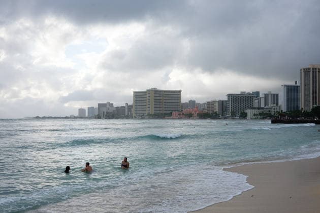 August 16, 2026, Honolulu, Hawaii, USA: Tropical storm Lalaâ€⠢s worst affected Oahu and Waikiki beginning after 1:00 a.m. Sunday August 16, 2026 and lasted, tapering, through mid-afternoon leaving behind flooding, downed trees, and more than 130,000 Hawaiian Electric customers without power at 4:00 p.m. But at sunset Waikiki Beach was packed with people taking advantage of a brief respite from the rain that the National Weather Service forecasts will last through the week as the slow-moving storm moves Northwest beneath the Hawaiian archipelago. Schools, government offices and many businesses will remain closed on Monday as people on O‘ahu sort through the stormâ€⠢s consequences. Honolulu USA - ZUMAm255 20260816_znp_m255_011 Copyright: xJ.xMattx