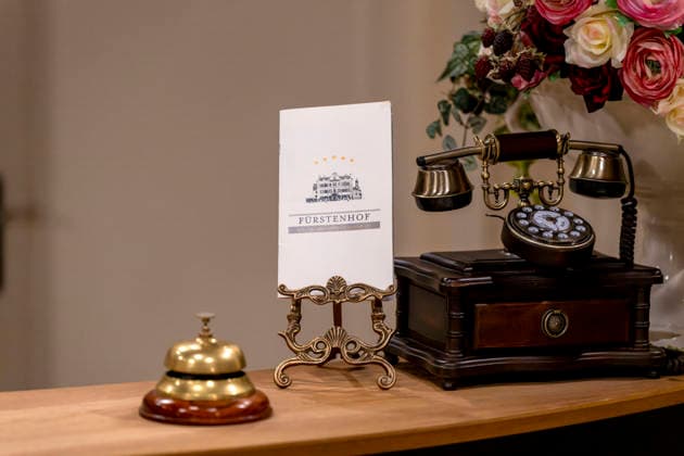 September 16, 2026, ARD telenovela *STURM DER LIEBE*, photo shoot for Season 23 on the film set in Munich, at Bavaria Film in Geiselgasteig, in the studio set of the fictional Hotel Fürstenhof reception area with a telephone and doorbell, September 16, 2026, ARD series *Sturm der Liebe* September 16, 2026, ARD series *Sturm der Liebe*