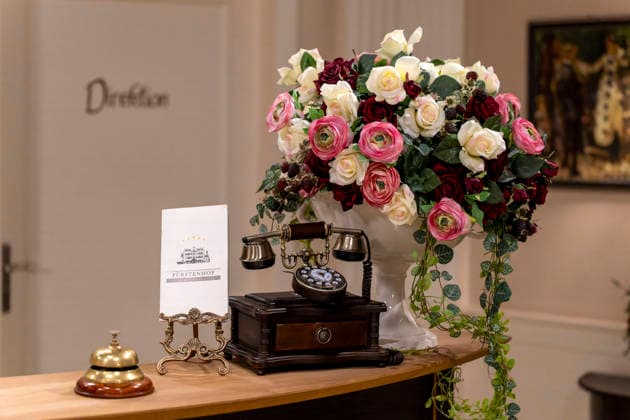 September 16, 2026, ARD telenovela *STURM DER LIEBE*, photo shoot for Season 23 on the film set in Munich, at Bavaria Film in Geiselgasteig, in the studio set of the fictional Hotel Fürstenhof reception area with a telephone and doorbell, September 16, 2026, ARD series *Sturm der Liebe* September 16, 2026, ARD series *Sturm der Liebe*