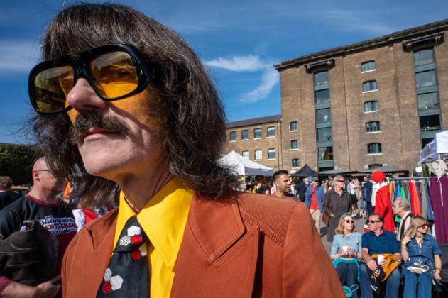 September 26, 2026, London, United Kingdom: An attendee to the kings Cross Classic Car Boot London. The Kings Cross Classic Car Boot Sale returned to Granary Square and Stable Street, King™s Cross, London, for its 11th year. Held several times throughout the year, the event brings together vintage fashion, second-hand clothing, jewellery, homewares, collectables and vinyl records alongside classic cars, motorcycles and commercial vehicles. Visitors browsed stalls and traders, with many making a special effort to dress in period clothing inspired by the 1950s, 1960s and 1970s.continuing a tradition associated with the event. London United Kingdom - ZUMAs197 20260926_aaa_s197_391 Copyright: xJamesxWilloughbyx