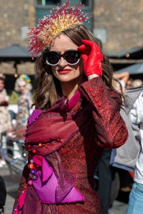 September 26, 2026, London, United Kingdom: An attendee at the King™s Cross Classic Car Boot Sale in London poses for photographs. The Kings Cross Classic Car Boot Sale returned to Granary Square and Stable Street, King™s Cross, London, for its 11th year. Held several times throughout the year, the event brings together vintage fashion, second-hand clothing, jewellery, homewares, collectables and vinyl records alongside classic cars, motorcycles and commercial vehicles. Visitors browsed stalls and traders, with many making a special effort to dress in period clothing inspired by the 1950s, 1960s and 1970s.continuing a tradition associated with the event. London United Kingdom - ZUMAs197 20260926_aaa_s197_393 Copyright: xJamesxWilloughbyx