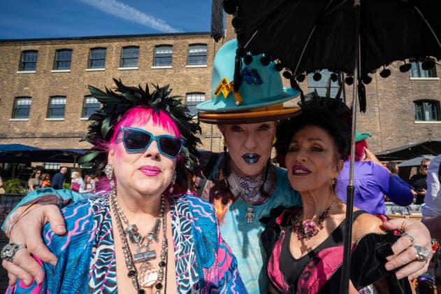 September 26, 2026, London, United Kingdom: Three women dressed in vintage clothing attend the September King™s Cross Classic Car Boot Sale at Granary Square in King™s Cross, London. The Kings Cross Classic Car Boot Sale returned to Granary Square and Stable Street, King™s Cross, London, for its 11th year. Held several times throughout the year, the event brings together vintage fashion, second-hand clothing, jewellery, homewares, collectables and vinyl records alongside classic cars, motorcycles and commercial vehicles. Visitors browsed stalls and traders, with many making a special effort to dress in period clothing inspired by the 1950s, 1960s and 1970s.continuing a tradition associated with the event. London United Kingdom - ZUMAs197 20260926_aaa_s197_384 Copyright: xJamesxWilloughbyx