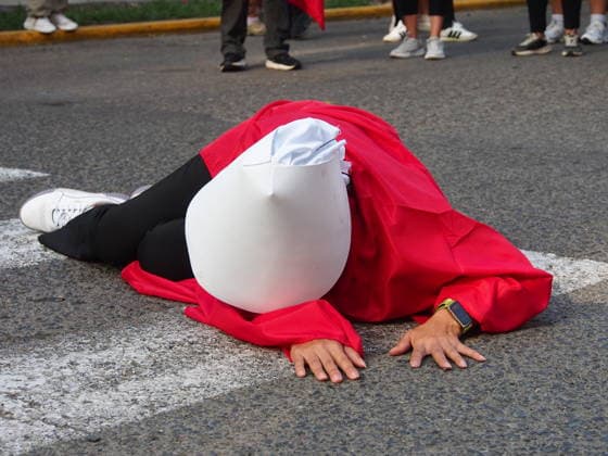 September 26, 2026, Lima, Lima, Peru: Woman dressed like the The Handmaid s Tale lying on the track when on International Safe Abortion Day hundreds of women, wearing green scarf, carry out a demonstration demanding legal, safe, and free abortion in Peru, as part of the comprehensive health of girls, adolescents, women, and anyone with the possibility of gestating. Abortion in Peru, a conservative country, is illegal and punishable Lima Peru - ZUMAg240 20260926_zip_g240_013 Copyright: xCarlosxGarciaxGranthonx