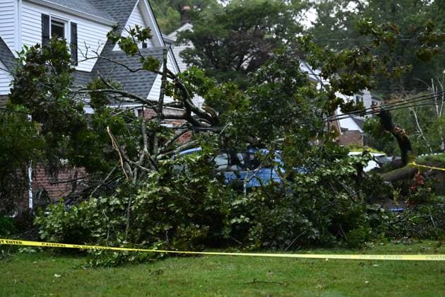 September 27, 2026, Ridgewood, New Jersey, USA: A tree is seen uprooted with wires down outside of a home on Gilbert Street during a nor easter storm in Ridgewood, New Jersey, United States, on Sunday, September 27, 2026. Heavy rain and strong winds battered the northeastern United States as an unusually powerful autumn storm intensified, forcing the cancellation of hundreds of flights and leaving tens of thousands of people without power. New York, Boston and Philadelphia were among the areas affected by the storm, as authorities warned of potential major flooding and road closures. Ridgewood USA - ZUMAs197 20260927_aaa_s197_001 Copyright: xKylexMazzax