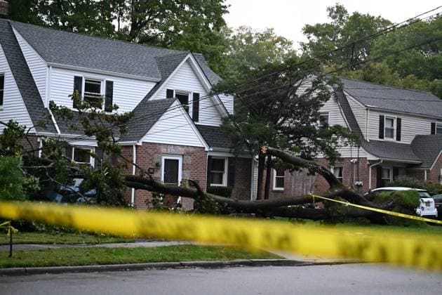 September 27, 2026, Ridgewood, New Jersey, USA: A tree is seen uprooted with wires down outside of a home on Gilbert Street during a nor easter storm in Ridgewood, New Jersey, United States, on Sunday, September 27, 2026. Heavy rain and strong winds battered the northeastern United States as an unusually powerful autumn storm intensified, forcing the cancellation of hundreds of flights and leaving tens of thousands of people without power. New York, Boston and Philadelphia were among the areas affected by the storm, as authorities warned of potential major flooding and road closures. Ridgewood USA - ZUMAs197 20260927_aaa_s197_009 Copyright: xKylexMazzax