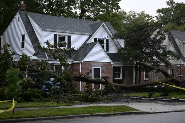 September 27, 2026, Ridgewood, New Jersey, USA: A tree is seen uprooted with wires down outside of a home on Gilbert Street during a nor easter storm in Ridgewood, New Jersey, United States, on Sunday, September 27, 2026. Heavy rain and strong winds battered the northeastern United States as an unusually powerful autumn storm intensified, forcing the cancellation of hundreds of flights and leaving tens of thousands of people without power. New York, Boston and Philadelphia were among the areas affected by the storm, as authorities warned of potential major flooding and road closures. Ridgewood USA - ZUMAs197 20260927_aaa_s197_010 Copyright: xKylexMazzax