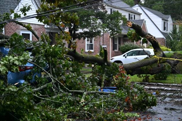 September 27, 2026, Ridgewood, New Jersey, USA: A tree is seen uprooted with wires down outside of a home on Gilbert Street during a nor easter storm in Ridgewood, New Jersey, United States, on Sunday, September 27, 2026. Heavy rain and strong winds battered the northeastern United States as an unusually powerful autumn storm intensified, forcing the cancellation of hundreds of flights and leaving tens of thousands of people without power. New York, Boston and Philadelphia were among the areas affected by the storm, as authorities warned of potential major flooding and road closures. Ridgewood USA - ZUMAs197 20260927_aaa_s197_011 Copyright: xKylexMazzax