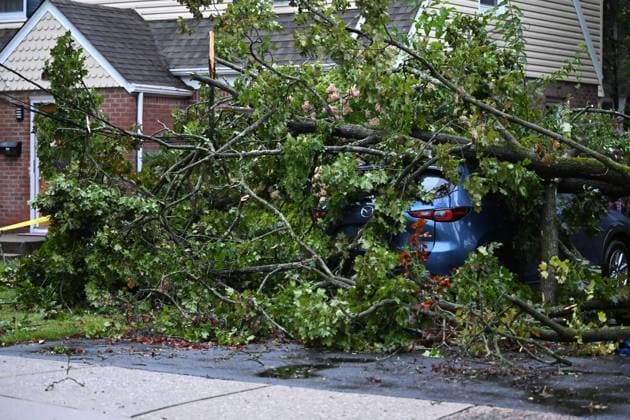 September 27, 2026, Ridgewood, New Jersey, USA: A tree is seen uprooted with wires down outside of a home on Gilbert Street during a nor easter storm in Ridgewood, New Jersey, United States, on Sunday, September 27, 2026. Heavy rain and strong winds battered the northeastern United States as an unusually powerful autumn storm intensified, forcing the cancellation of hundreds of flights and leaving tens of thousands of people without power. New York, Boston and Philadelphia were among the areas affected by the storm, as authorities warned of potential major flooding and road closures. Ridgewood USA - ZUMAs197 20260927_aaa_s197_012 Copyright: xKylexMazzax