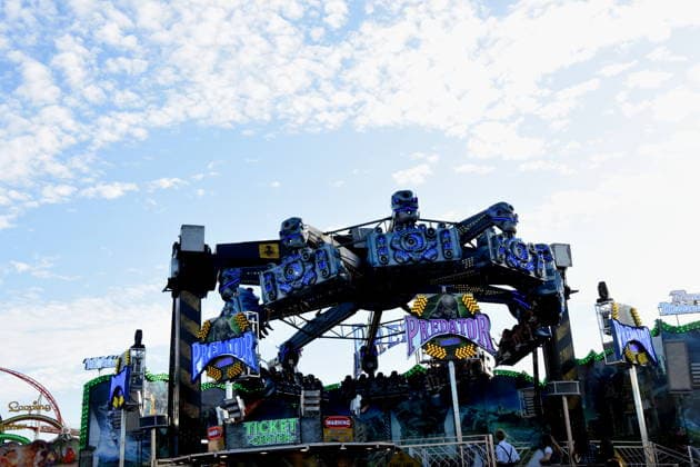 Munich, September 28, 2026, Theresienwiesn, Oktoberfest, carnival operator, Predator ride, visitors, photo, Munich