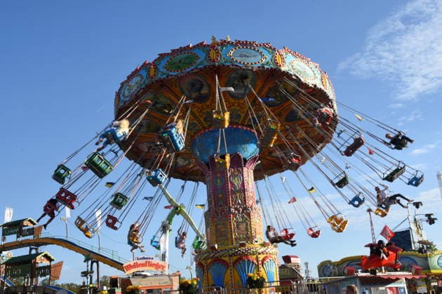 Munich, September 28, 2026, Theresienwiesn, Oktoberfest, carnival vendors, rides, carousel, visitors, photo, Munich