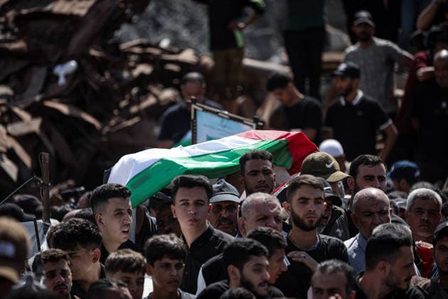 Palestinians Hold Mass Funeral for 105 Recovered from Gaza Rubble Palestinians take part in a mass funeral for 105 Palestinians whose remains were recovered from beneath the rubble of destroyed buildings in the al-Taj area of Gaza City’s al-Yarmouk neighborhood on October 1, 2026. The victims, including women and children, were killed in Israeli airstrikes during the early stages of the war, with families gathering for their funeral and burial after their remains had been trapped under the rubble for years. Photo by Bilal Osama apaimages Gaza city Gaza Strip Palestinian Territory 011026_Gaza_BO_00(26) Copyright: xapaimagesxBilalxOsamax xapaimagesx