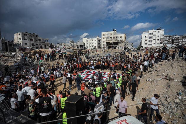 Palestinians Hold Mass Funeral for 105 Recovered from Gaza Rubble Palestinians take part in a mass funeral for 105 Palestinians whose remains were recovered from beneath the rubble of destroyed buildings in the al-Taj area of Gaza City’s al-Yarmouk neighborhood on October 1, 2026. The victims, including women and children, were killed in Israeli airstrikes during the early stages of the war, with families gathering for their funeral and burial after their remains had been trapped under the rubble for years. Photo by Bilal Osama apaimages Gaza city Gaza Strip Palestinian Territory 011026_Gaza_BO_00(4) Copyright: xapaimagesxBilalxOsamax xapaimagesx