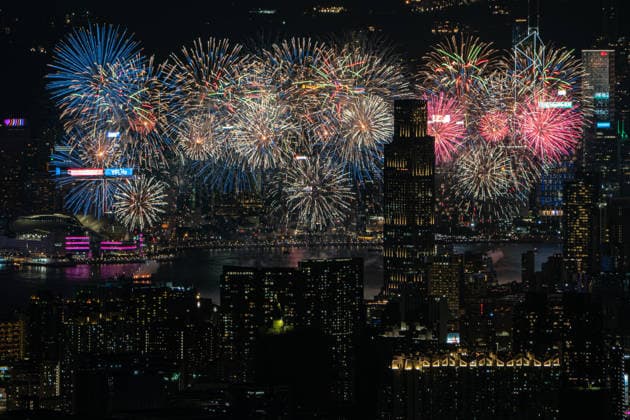 HONG KONG-DAILY NATIONAL-DAY A panoramic general view captured from Kowloon Peak (Fei Ngo Shan) shows fireworks illuminating the night sky above Victoria Harbour during the 77th National Day celebration on October 1, 2026 in Hong Kong, overlooking the expansive cityscapes of the southern Kowloon Peninsula and the illuminated skyline of northern Hong Kong Island. (Photo by Kevin Li TMHK via Nexpher Images) Hong Kong