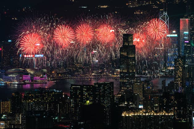HONG KONG-DAILY NATIONAL-DAY A panoramic general view captured from Kowloon Peak (Fei Ngo Shan) shows fireworks illuminating the night sky above Victoria Harbour during the 77th National Day celebration on October 1, 2026 in Hong Kong, overlooking the expansive cityscapes of the southern Kowloon Peninsula and the illuminated skyline of northern Hong Kong Island. (Photo by Kevin Li TMHK via Nexpher Images) Hong Kong