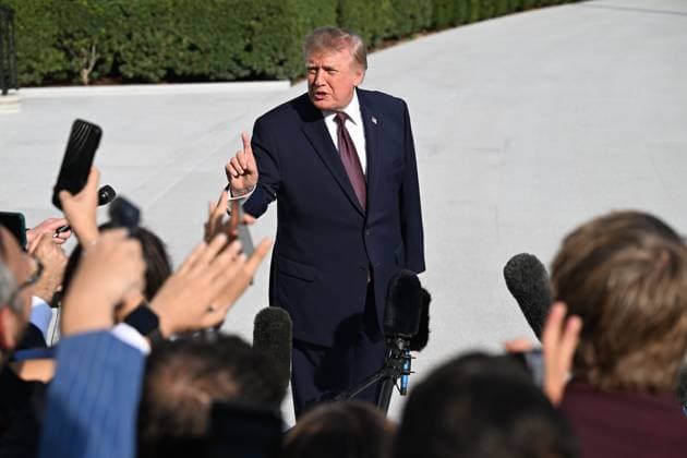 October 2, 2026, Washington, Dc, USA: U.S. President Donald Trump talks to the media before boarding Marine One on the South Lawn of the White House in Washington, DC, United States, on October 2, 2026. Washington USA - ZUMAs197 20261002_aaa_s197_269 Copyright: xKylexMazzax
