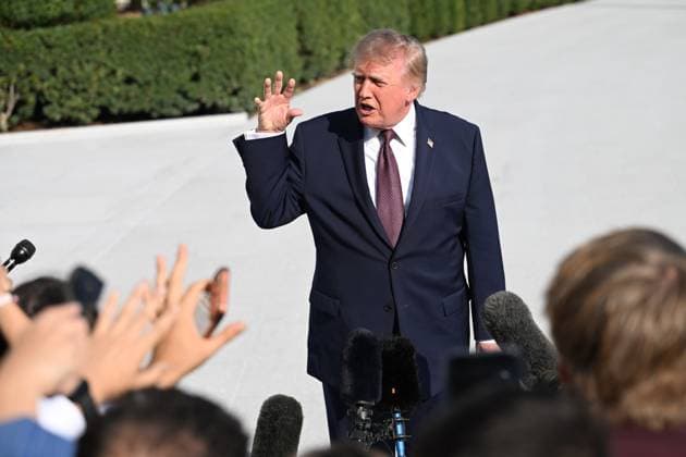 October 2, 2026, Washington, Dc, USA: U.S. President Donald Trump talks to the media before boarding Marine One on the South Lawn of the White House in Washington, DC, United States, on October 2, 2026. Washington USA - ZUMAs197 20261002_aaa_s197_270 Copyright: xKylexMazzax