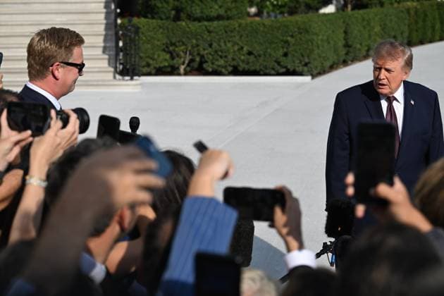 October 2, 2026, Washington, Dc, USA: U.S. President Donald Trump talks to the media before boarding Marine One on the South Lawn of the White House in Washington, DC, United States, on October 2, 2026. Washington USA - ZUMAs197 20261002_aaa_s197_279 Copyright: xKylexMazzax