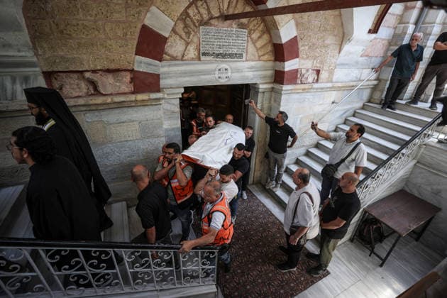 Funeral ceremony for two Palestinian Christians after an Israeli attack in Gaza GAZA CITY, PALESTINE - OCTOBER 03 : Poeple gather during the funeral ceremony for two Palestinian Christian women at the St. Porphyrios Greek Orthodox Church in Gaza City, Palestine on October 03, 2026. Meysa Hidir Ibrahim Abu Dawud and her daughter Marya Hafiz Michel Najjar were killed after an Israeli airstrike. Ali Jadallah Anadolu Gaza City Gaza. Editorial use only. Please get in touch for any other usage. Copyright: x2026xAnadoluxAlixJadallahx