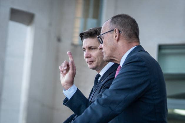 Chancellor Friedrich Merz with his guest Mindaugas Sinkeviciusius, Prime Minister of Lithuania, at the Federal Chancellery; on the terrace of the Federal Chancellery overlooking the Reichstag building, which houses the Bundestag; the Federal Chancellor receives the Prime Minister of the Republic of Lithuania at the Federal Chancellery, Berlin, Germany; Federal Chancellery