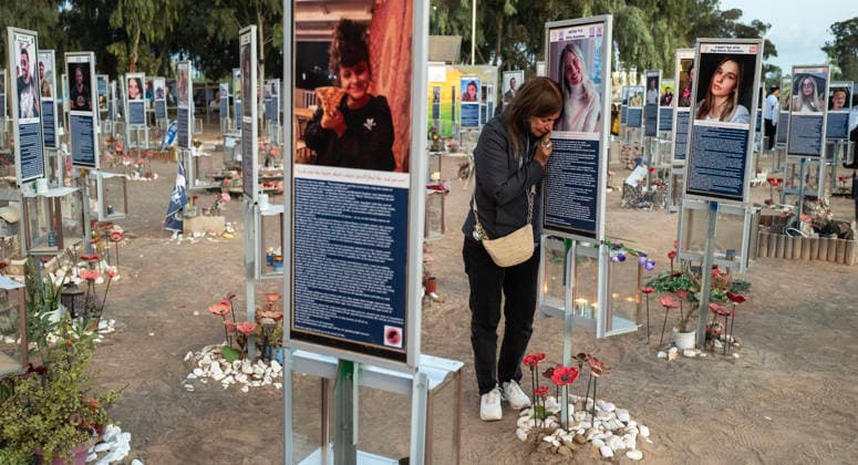 Israelis mourn at sunrise in the Re im memorial on the third anniversary where Hamas massacred 364 people and took another 40 hostages during the Nova dance party on October 7, 2023, near Kibbutz Re im, southern Israel on Wednesday, October 7, 2026. The Hamas cross-border attacks resulted in the deaths of approximately 1,200 people and the abduction of 251 hostages. ISR20260608002827 JimxHollander