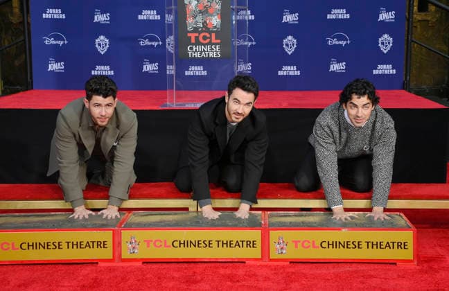 Jonas Brothers immortalise handprints in cement at the TCL Chinese Theatre in Los Angeles