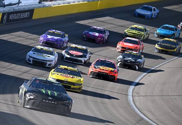LAS VEGAS, NV - OCTOBER 20: Ty Gibbs ( 54 Joe Gibbs Racing Monster Energy Toyota) leads the field in turn two during the stage 2 restart during the South Point 400 NASCAR, Motorsport, USA Cup Series playoff race on October 20, 2024, at Las Vegas Motor Speedway in Las Vegas, NV. (Photo by Will Lester LVMS Icon Sportswire) AUTO: OCT 20 NASCAR Cup Series South Point 400 EDITORIAL USE ONLY Icon241020394