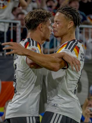Munich, Germany October 1, 2026 UEFA Nations League 2026–2027 League Phase Group A2 Match 3 Germany vs. Serbia Pictured from left: Goal scorer Tom Bischof (GER) celebrates his 1–0 goal with Derry Scherhant (GER). DFB and DFL regulations prohibit any use of photographs as image sequences and or quasi-video. Allianz Arena, Bayern Copyright: xFotostandx xSchäferx