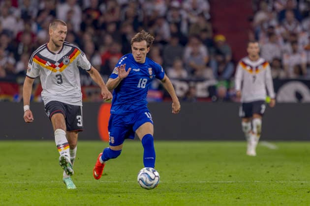 Munich, Germany October 1, 2026 UEFA Nations League 2026–2027 League Phase Group A2 Match 3 Germany vs. Serbia Pictured from left: Waldemar Anton (GER) and Mihajlo Cvetkovic (SRB) in a tackle. DFB and DFL regulations prohibit any use of photographs as image sequences and or quasi-video footage. Allianz Arena, Bavaria Copyright: xFotostandx xSchäferx