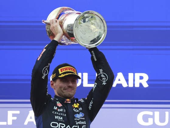 KUALA LUMPUR, MALAYSIA - OCTOBER 04: Max Verstappen of the Netherlands and Oracle Red Bull Racing celebrates on the podium with trophy after winning after the race of the FIA Formula 1 Grand Prix of Bahrain in Malaysia at the Sepang Circuit on October 04, 2026 in Kuala Lumpur, Malaysia. (Photo by Qian Jun SPP-Paddocker) Copyright: xQianxJun SPP-Paddockerx Sportspressphoto_SPR246576