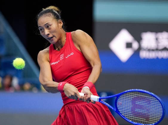 (261005) -- BEIJING, Oct. 5, 2026 -- Zheng Qinwen of China hits a return during the women s singles round of 32 match against Marie Bouzkova of the Czech Republic at 2026 China Open tennis tournament in Beijing, China, Oct. 5, 2026. ) (SP)CHINA-BEIJING-TENNIS-CHINA OPEN-WOMEN S SINGLES(CN) SunxFei