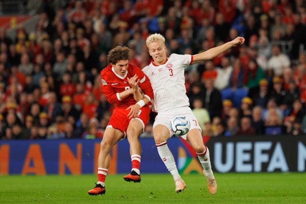 RECORD DATE NOT STATED 4th October 2026; Cardiff City Stadium, Cardiff, Wales; UEFA Nations League Football, Wales versus Denmark; Lewis Koumas of Wales and Oliver Provstgaard of Denmark battle for ball AmandaxMcMaster