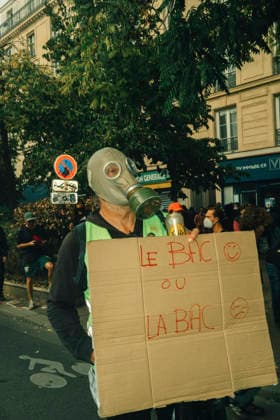 Paris Students Protest Education Conditions A demonstrator carries a megaphone and a cardboard sign on their back in Paris, France, on October 6, 2026. France s Interior Ministry said 256,000 people marched nationwide, including 56,000 in Paris, during the student-led day of action over school conditions. High school students called for more education funding and staff, smaller classes and improved facilities, with teachers, parents and unions joining demonstrations. Paris Ile de France France Copyright: xDavoodxMaeilix