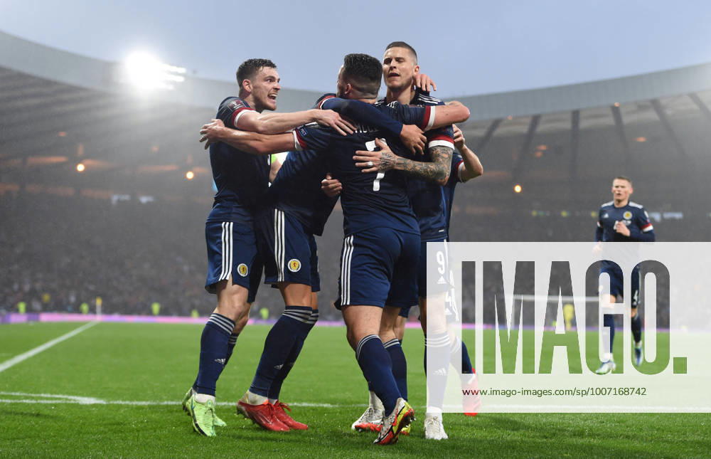 Glasgow, Scotland, 9th October 2021. John McGinn of Scotland is mobbed by teammates after scoring ScotlandÕs 1st goal during the FIFA World Cup, WM, Weltmeisterschaft, Fussball qualifiers match at Hampden Park, Glasgow. Picture credit should read: Neil Hanna Sportimage . SPI-1226-0020