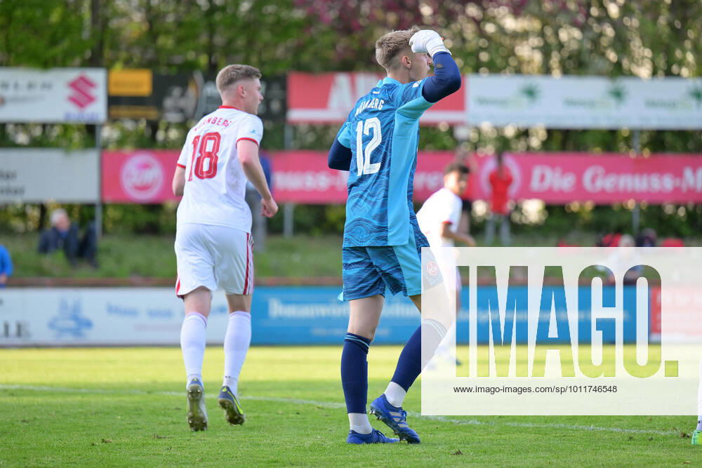 Soccer, Men, Regionalliga Bayern, Season 2021 2022, Matchday 28, TSV Rain Lech 1 FC Nuremberg II, 03 05 2022 Goalkeeper Jan Reichert No 12 1 FC Nuremberg II cheers after his held penalty, Fabian Menig No 4 1 FC Nuremberg II and Noel Knothe No 18 1 FC Nuremberg II rejoice with him Rain Georg Weber Stadium Bavaria Germany
