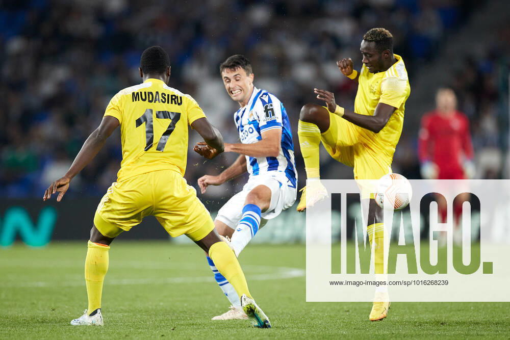 Ander Guevara of Real Sociedad competes for the ball with Mudasiru Salifu of FC Sheriff Tiraspol during the UEFA Europa League group E match between Real Sociedad and FC Sheriff Tiraspol at Reale Arena on October 13, 2022, in San Sebastian, Spain. SAN SEBASTIAN SPAIN - ZUMAa181 20221013_zaa_a181_102