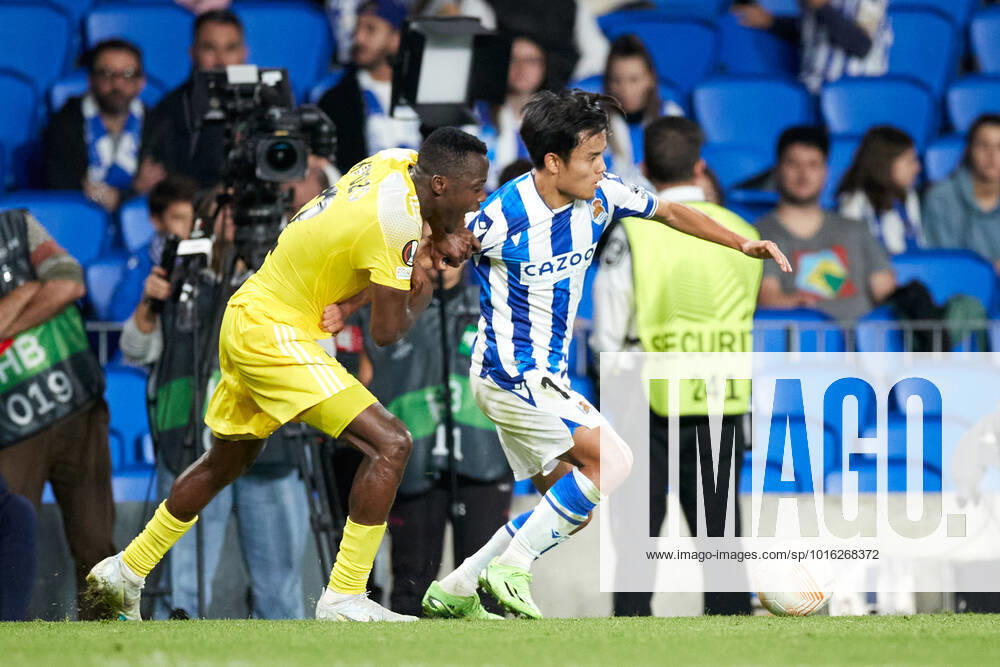 Takefusa Kubo of Real Sociedad competes for the ball with Patrick Kpozo of FC Sheriff Tiraspol during the UEFA Europa League group E match between Real Sociedad and FC Sheriff Tiraspol at Reale Arena on October 13, 2022, in San Sebastian, Spain. SAN SEBASTIAN SPAIN - ZUMAa181 20221013_zaa_a181_111